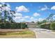 Charming single-story home with a two-car garage and a manicured hedge in the front yard at 2371 Manheim Ave, North Port, FL 34286