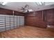 Spacious garage featuring stained wood accent wall, finished floors, and ample room for parking and storage solutions at 2371 Manheim Ave, North Port, FL 34286