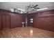 Finished garage offering extra space and potential with painted wood accent wall, updated flooring and utility sink at 2371 Manheim Ave, North Port, FL 34286