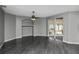Spacious living room features luxury floors, neutral colors, and sliding glass doors leading to screened patio at 2371 Manheim Ave, North Port, FL 34286