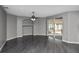 Expansive living room with luxury floors, neutral paint, and sliding glass doors with access to the screened-in patio at 2371 Manheim Ave, North Port, FL 34286