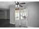 Living room with sliders leading to a glass enclosed porch at 2371 Manheim Ave, North Port, FL 34286