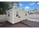 Exterior view of a well-maintained shed with durable siding and a ramp for easy access at 2371 Manheim Ave, North Port, FL 34286