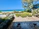 Backyard overlooking the beach with a shared pool and easy beach access at 2412 N Gulf Dr # 119, Bradenton Beach, FL 34217