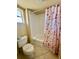 Clean bathroom with shower-tub combo and decorative shower curtain at 2412 N Gulf Dr # 119, Bradenton Beach, FL 34217