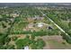 A birds eye view highlights this properties exceptional land surrounded by verdant trees and vast acreage at 27510 67Th E Ave, Myakka City, FL 34251
