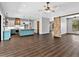 Spacious open-concept kitchen with a large island, stainless steel appliances, and modern wood accents at 27510 67Th E Ave, Myakka City, FL 34251
