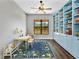 Cozy playroom featuring built-in bookshelves, a colorful rug, and natural light at 27510 67Th E Ave, Myakka City, FL 34251