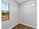 Bright empty room with gray walls and luxury vinyl plank flooring at 27510 67Th E Ave, Myakka City, FL 34251