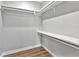 A walk-in closet with rods and shelving for optimal storage is displayed at 27510 67Th E Ave, Myakka City, FL 34251