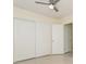 Comfortable bedroom with closet, window providing natural light and neutral decor at 2804 W Mark Dr, Sarasota, FL 34232
