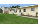 Cozy single-story home with a green lawn and a welcoming front entrance at 2804 W Mark Dr, Sarasota, FL 34232