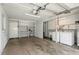 View of the garage with washer and dryer and built in shelving for storage at 2804 W Mark Dr, Sarasota, FL 34232