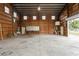 Interior view of garage with shelving, workbenches, and overhead lighting at 2804 W Mark Dr, Sarasota, FL 34232
