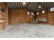 Interior view of garage with shelving, workbenches, and overhead lighting at 2804 W Mark Dr, Sarasota, FL 34232