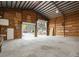 Interior view of garage with shelving, workbenches, and overhead lighting at 2804 W Mark Dr, Sarasota, FL 34232