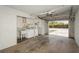 Spacious garage with laundry area and an open door showing the driveway at 2804 W Mark Dr, Sarasota, FL 34232