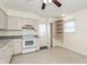 Bright kitchen features sleek countertops, white appliances, and ample cabinet space at 2804 W Mark Dr, Sarasota, FL 34232