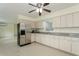 Functional kitchen featuring ample counter space, stainless steel appliances, and bright lighting at 2804 W Mark Dr, Sarasota, FL 34232