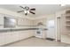 Bright kitchen features sleek countertops, white appliances, and ample cabinet space at 2804 W Mark Dr, Sarasota, FL 34232