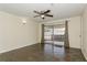 Inviting living room with tile flooring and sliding glass doors to backyard at 2804 W Mark Dr, Sarasota, FL 34232