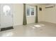 Bright living room featuring a large window with neutral-toned walls and floors at 2804 W Mark Dr, Sarasota, FL 34232