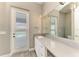 Stylish bathroom with granite countertops, white cabinetry, and a single sink, providing a clean and modern aesthetic at 3518 Recurve Cir, Sarasota, FL 34240