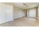 Spacious bedroom features wood-look flooring, recessed lighting, ceiling fan, and large closets for ample storage at 3518 Recurve Cir, Sarasota, FL 34240
