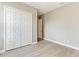 Bright bedroom with wood-look floors, recessed lighting, and a large closet with ample storage space at 3518 Recurve Cir, Sarasota, FL 34240