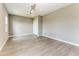 Bright bedroom with wood-look floors, a ceiling fan, recessed lighting, and a closet offering ample space at 3518 Recurve Cir, Sarasota, FL 34240