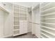 Walk-in closet featuring custom shelving, drawers, and hanging space to keep wardrobe organized at 3518 Recurve Cir, Sarasota, FL 34240