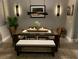 Elegant dining room with modern lighting, a glass-top table, and comfortable seating at 3518 Recurve Cir, Sarasota, FL 34240