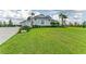 Beautiful single-story home with a lush green lawn, landscaping, and well maintained exterior at 3518 Recurve Cir, Sarasota, FL 34240