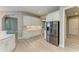 Bright kitchen featuring white cabinets, stainless steel appliances, and a tile backsplash at 3518 Recurve Cir, Sarasota, FL 34240