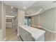 Open-concept living area with bar seating, light wood floors, and easy access to the pool area at 3518 Recurve Cir, Sarasota, FL 34240