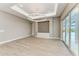 Open living room with recessed lighting and sliding glass doors leading to an outdoor space at 3518 Recurve Cir, Sarasota, FL 34240
