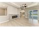 Bright living space with modern fireplace, decorative lighting and direct access to the pool area at 3518 Recurve Cir, Sarasota, FL 34240