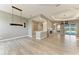Open living space featuring modern tile flooring, a bar area, and outdoor pool views at 3518 Recurve Cir, Sarasota, FL 34240