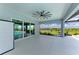 Spacious covered patio overlooking a scenic lake view, perfect for outdoor entertaining and relaxation at 3518 Recurve Cir, Sarasota, FL 34240