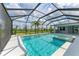 Inviting pool area with a screened enclosure, a spa, and lush landscaping offering a private oasis at 3518 Recurve Cir, Sarasota, FL 34240