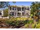 Stunning backyard with lush landscaping and patio furniture at 3521 Fair Oaks Ln, Longboat Key, FL 34228