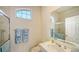 Small bathroom with walk-in shower, vanity, and single window at 3521 Fair Oaks Ln, Longboat Key, FL 34228