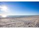 Beach with soft sand and ocean view on a sunny day at 3521 Fair Oaks Ln, Longboat Key, FL 34228