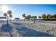 Beach with volley ball net and palm trees at 3521 Fair Oaks Ln, Longboat Key, FL 34228