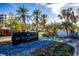 Elegant community entrance with manicured landscaping and a prominent sign for Bay Isles Beach Club at 3521 Fair Oaks Ln, Longboat Key, FL 34228