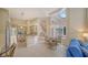 Open kitchen with center island, stainless appliances, breakfast nook, and staircase at 3521 Fair Oaks Ln, Longboat Key, FL 34228