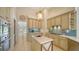 Open kitchen features stone countertops, stainless steel appliances, and backyard views at 3521 Fair Oaks Ln, Longboat Key, FL 34228