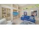 Relaxing living room with built-in shelves, comfortable furniture, and natural light at 3521 Fair Oaks Ln, Longboat Key, FL 34228