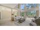 Bright living room features high ceilings, a large window with backyard views, and neutral decor at 3521 Fair Oaks Ln, Longboat Key, FL 34228