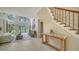 Bright living room features high ceilings, tile floors, and floor to ceiling windows with beautiful views at 3521 Fair Oaks Ln, Longboat Key, FL 34228